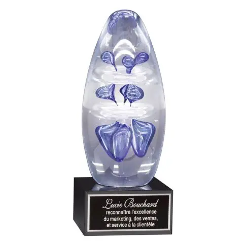 A glass trophy with blue butterfly designs on a black base.