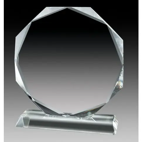 Transparent crystal award with multiple edges on a rectangular base.