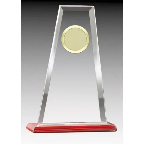 A sleek glass trophy with a circular gold emblem on a red base.