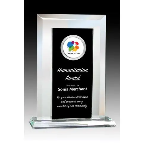 A sleek glass award with a black center and colorful logo.