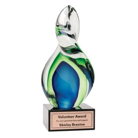 A colorful glass trophy with a blue and green swirl design.