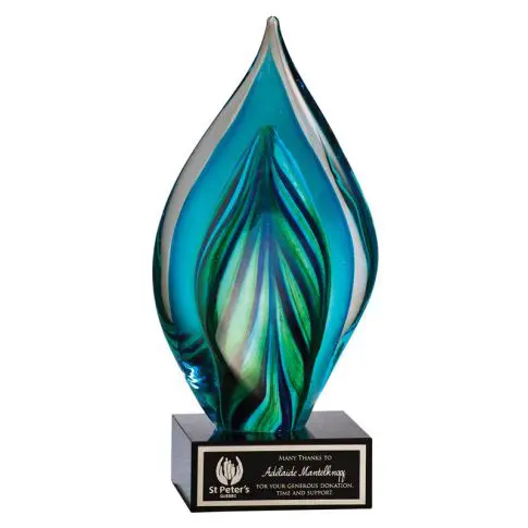 Elegant glass award with blue and green flame design on a black base.