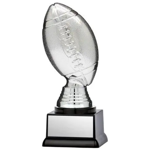 Angled crystal football award on pedestal