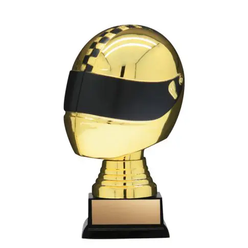 A gold trophy shaped like a helmet with a black visor.