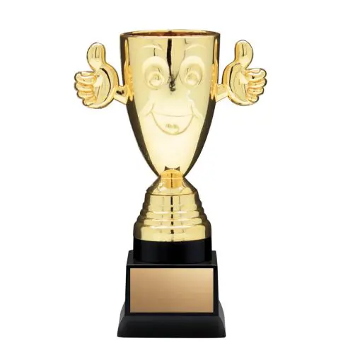 A golden trophy with smiling face and thumbs-up handles.