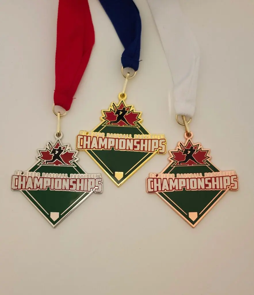 Three baseball championship medals with red, blue, and white ribbons.