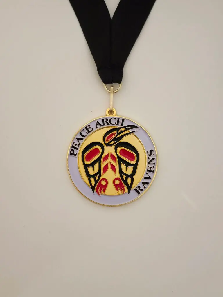 Medal with peace-themed design and inscription.