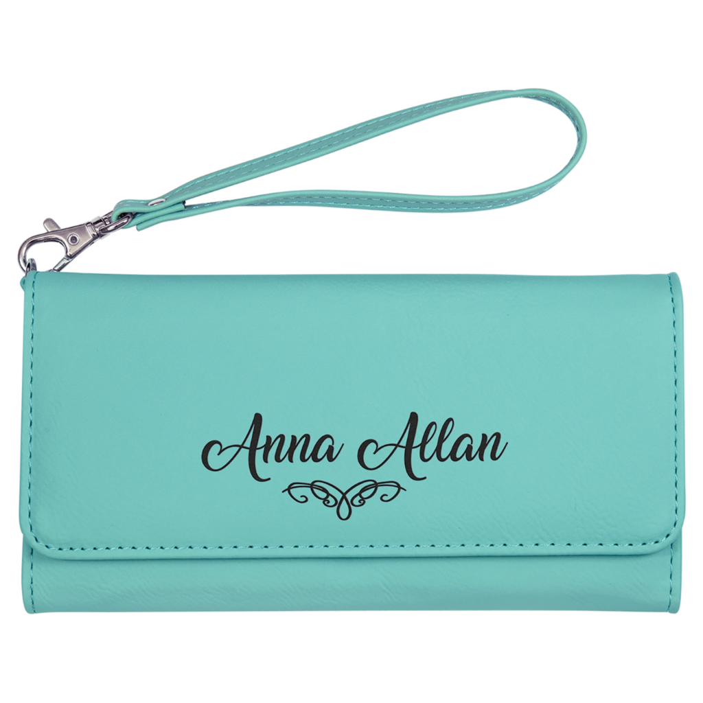 A turquoise wristlet wallet with the name 'Anna Allan' and a heart design.