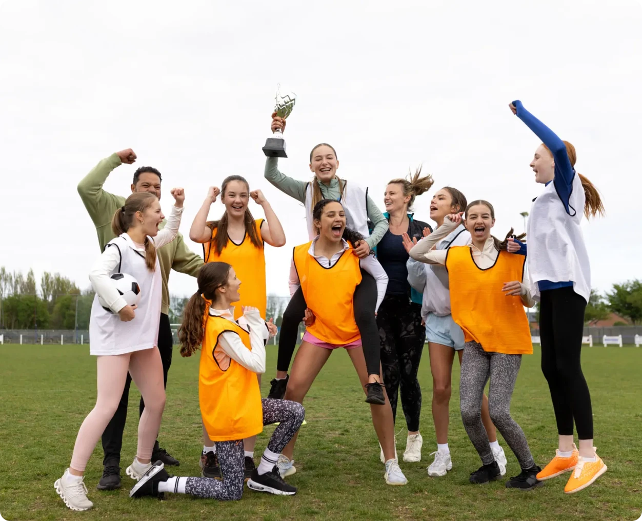 Team celebrating victory with a trophy